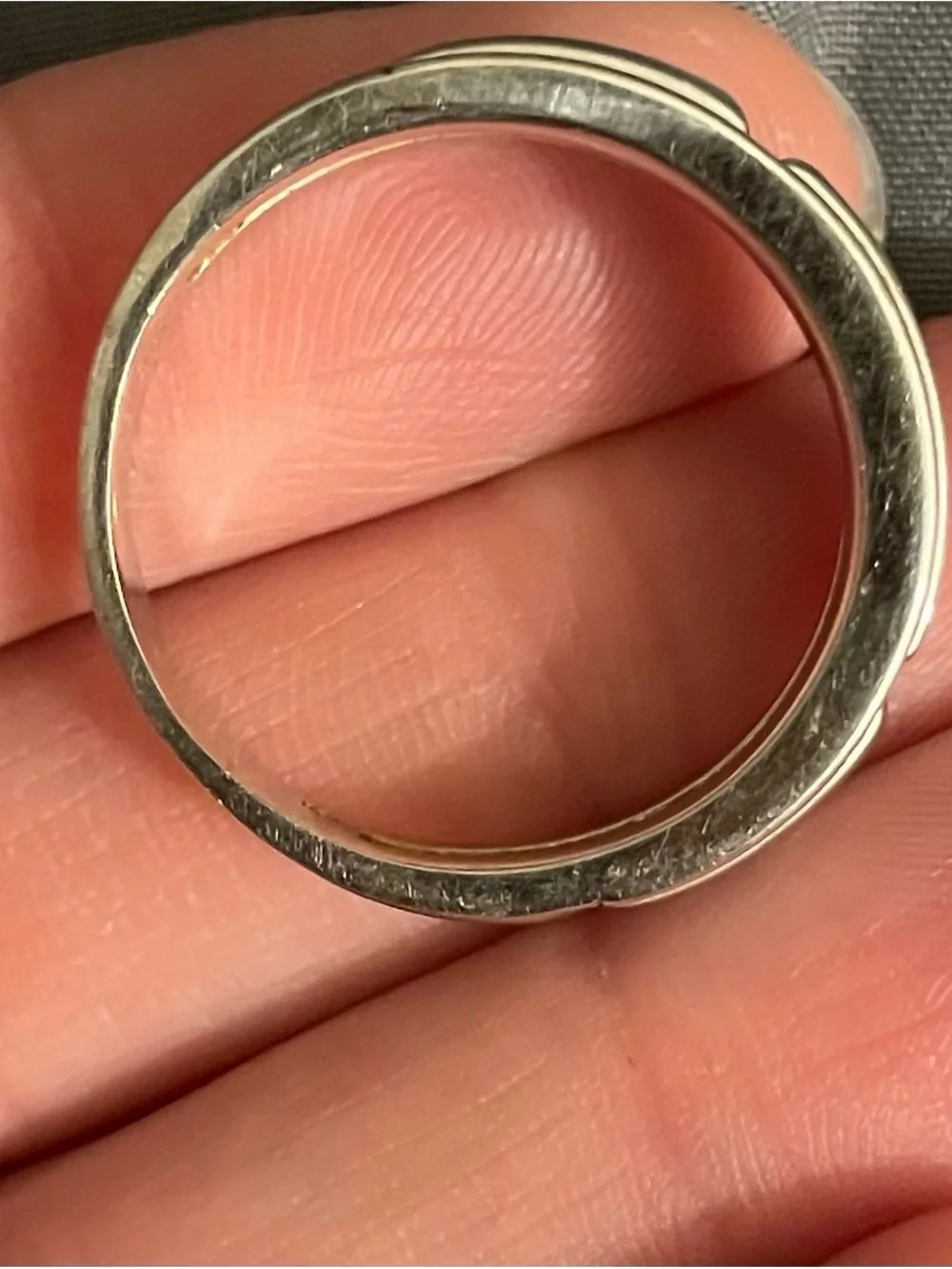 10K White Gold men’s ring. Weighing a little over 5 grams in weight.